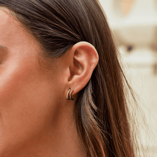 Krallen-Ohrringe aus Gold mit Kristall