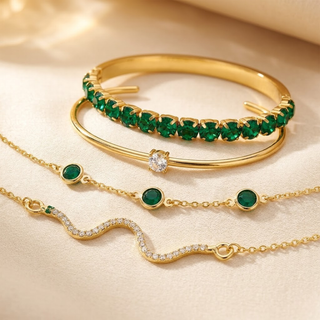 Gouden set armbanden met smaragd