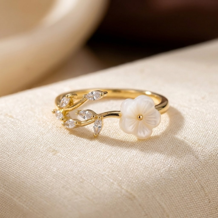 Gouden open ring met bloem en blad