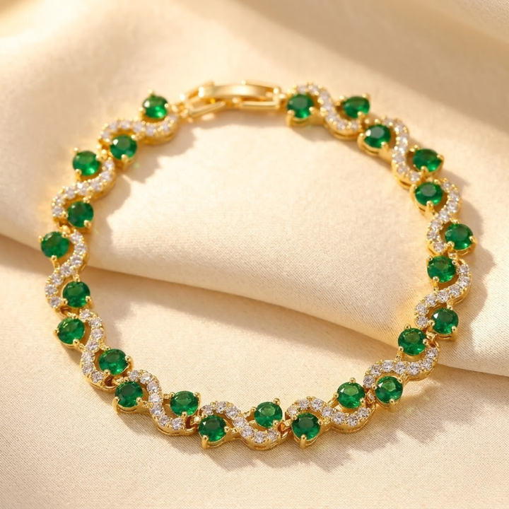 Gouden armband met smaragd en stralenkrans