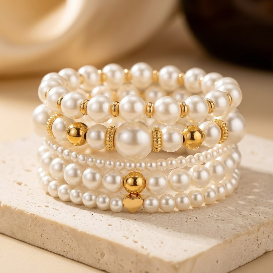 Gouden set armbanden met pareltjes