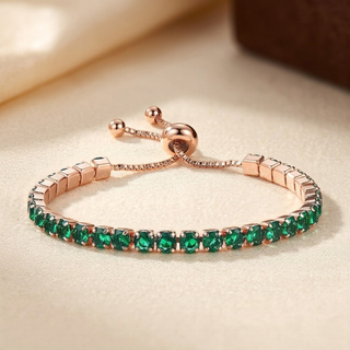 Verstelbare gouden armband rondom bezet met smaragd