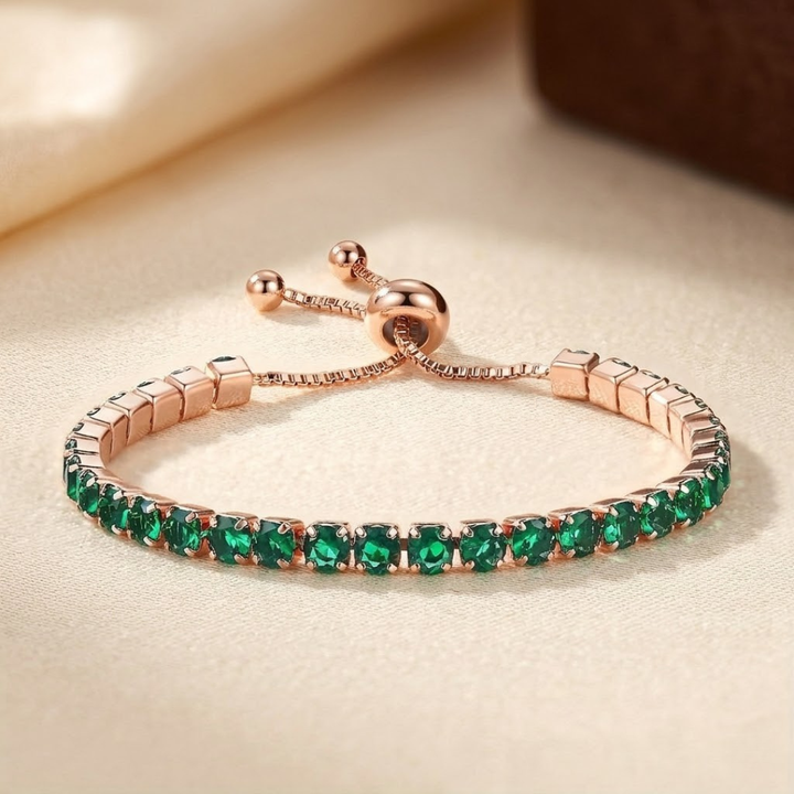 Verstelbare gouden armband rondom bezet met smaragd