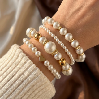Gouden set armbanden met pareltjes