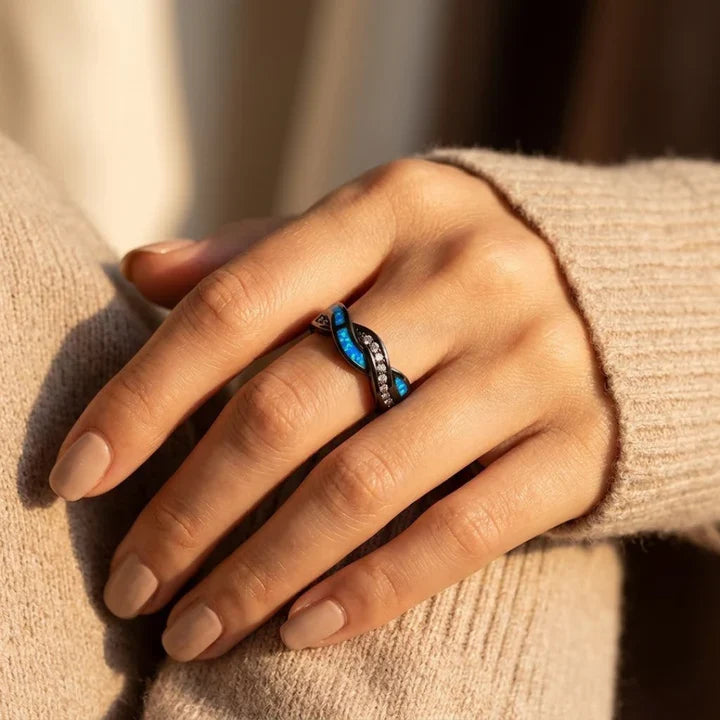 Zilveren gedraaide ring met inleg
