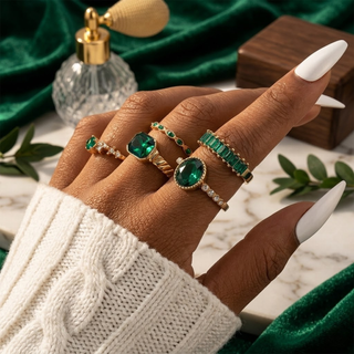 Gouden set ringen met smaragd
