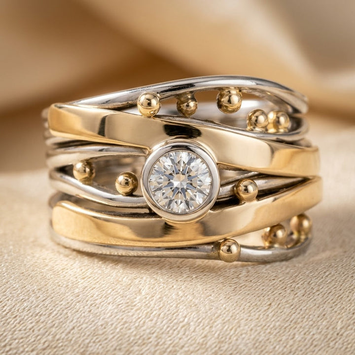 Ring in zilver en goud met gevatte steen
