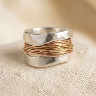 Gewikkelde ring in zilver en goud