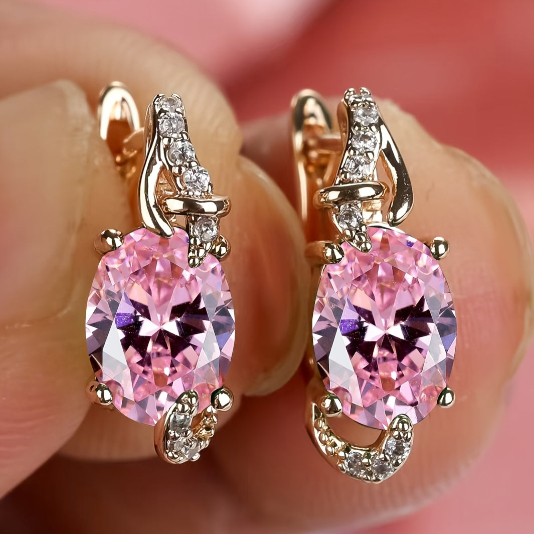 Goldene tropfenförmige Steinohrringe
