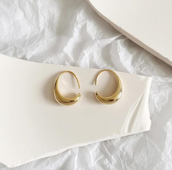 Ovale Creolen aus Gold und Silber