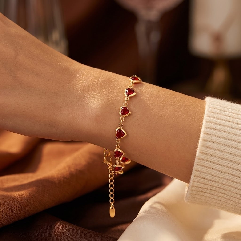 Gouden armband met robijnen hart