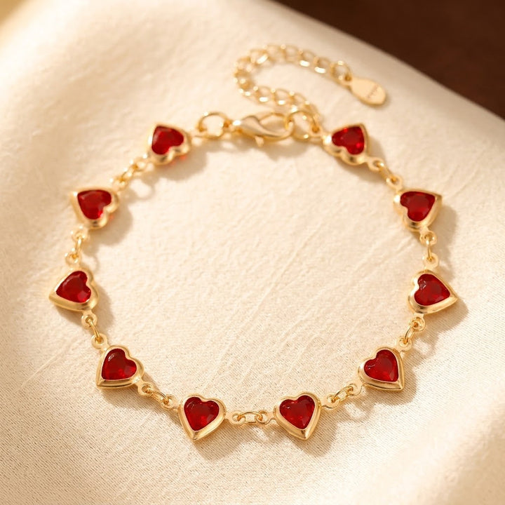 Gouden armband met robijnen hart