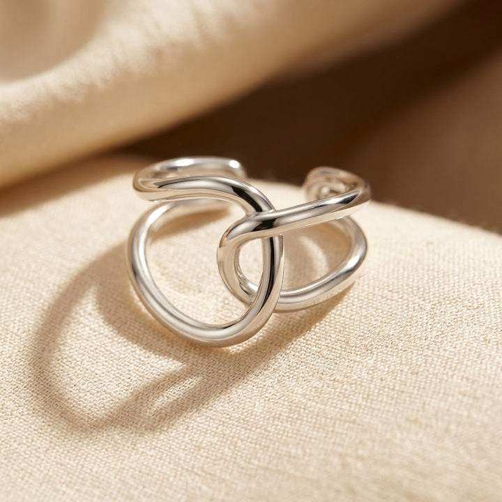Zilveren open ring met verstrengelde banden