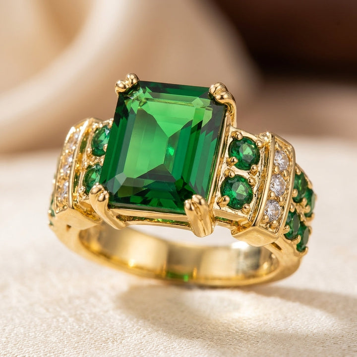 Gouden geometrische ring met smaragd