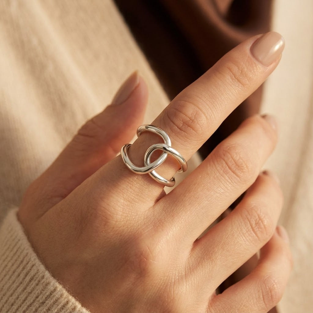 Zilveren open ring met verstrengelde banden