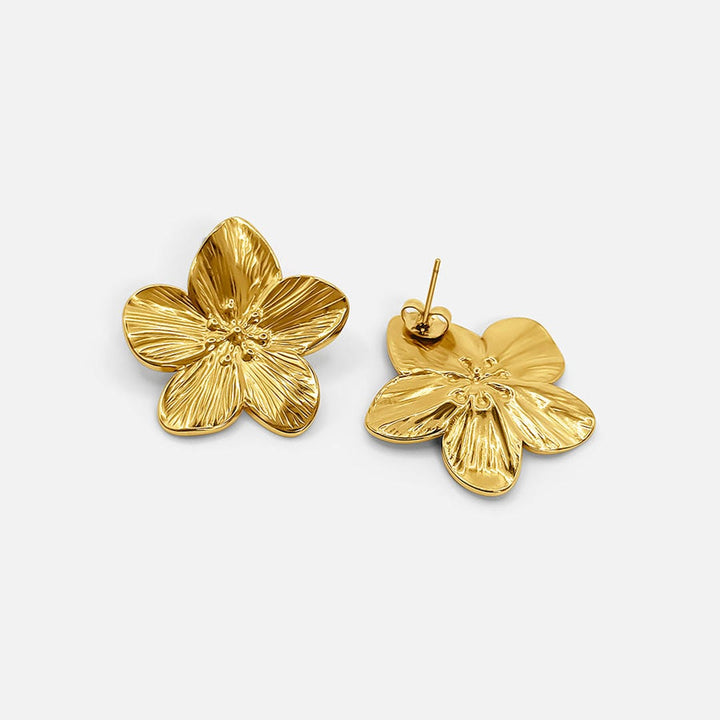 Elegante goldene Blumen-Ohrringe