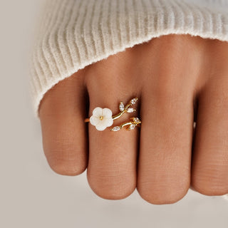 Gouden open ring met bloem en blad