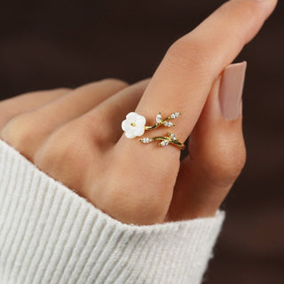 Gouden open ring met bloem en blad