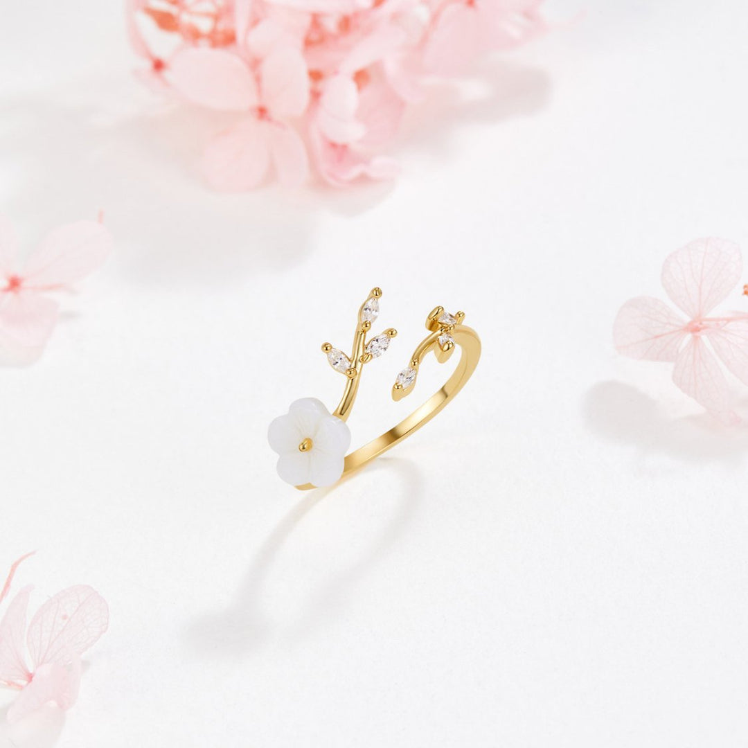 Gouden open ring met bloem en blad