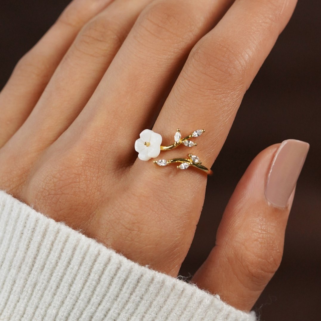Gouden open ring met bloem en blad